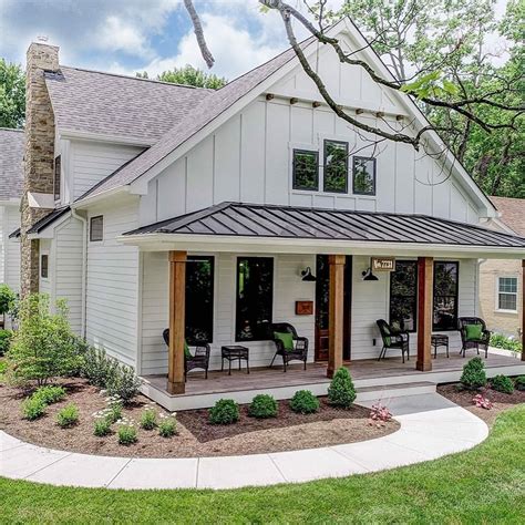 a white house with a porch and covered patio