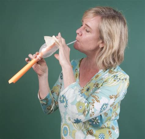 Here, a water bottle and a paper tube make a membranophone—an instrument that produces sound ...