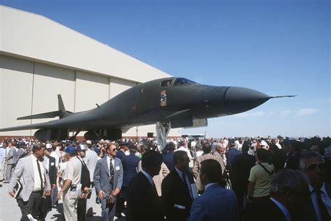 A crowd gathers to view the first production model B-1B aircraft during the rollout ceremony at ...