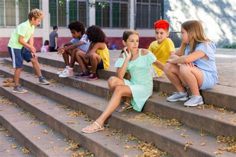 Positive Tweenagers Friendly Blabbing while Sitting on Steps Outdoors Stock Photo - Image of ...