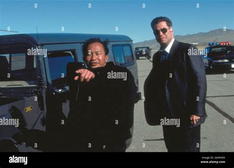 JOHN WOO, JOHN TRAVOLTA, FACE/OFF, 1997 Stock Photo - Alamy