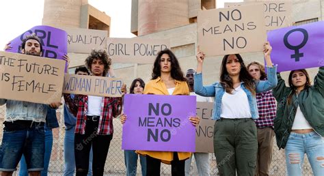 Premium Photo | Multiracial demonstrators looking at camera holding ...