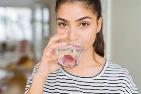 Beautiful Young Woman Drinking a Fresh Glass of Water at Home Stock ...