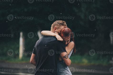 beautiful couple hugging in the rain 11739013 Stock Photo at Vecteezy