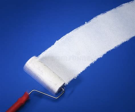 Paint Roller with White Paint on Blue Wall Stock Photo - Image of ...