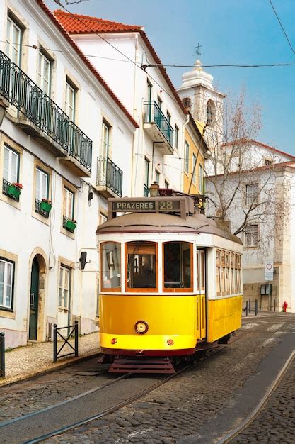 Premium Photo | Yellow 28 tram in alfama, lisbon, portugal