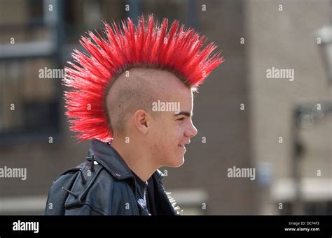 Punk boy with a red mohawk hairstyle Stock Photo - Alamy