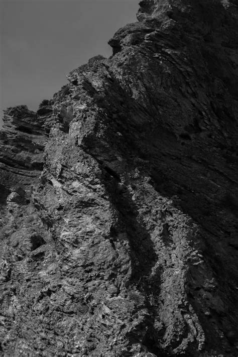 Close Up Photo of Black and White Rock Formation · Free Stock Photo