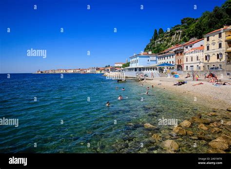 Piran, Istria, Slovenia - Beach life on the Fornace beach of the Mediterranean port of Piran ...