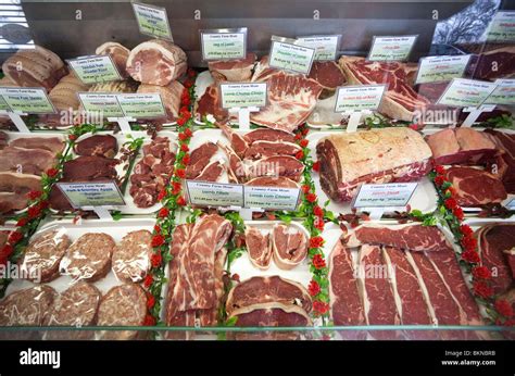 meat display at a butchers shop Stock Photo - Alamy