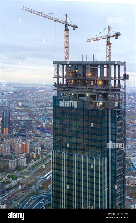 the construction of a modern skyscraper. Tower crane at construction ...