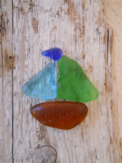 Sea glass sail boat on driftwood. | Beach glass crafts, Beach glass art ...