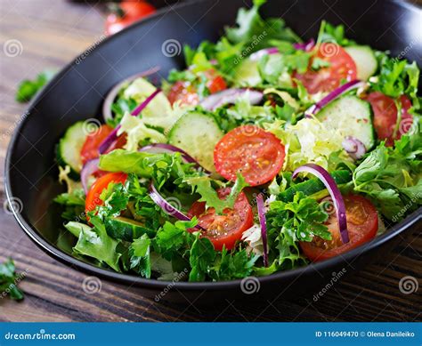 Salad from Tomatoes, Cucumber, Red Onions and Lettuce Leaves. Stock Photo - Image of detox ...