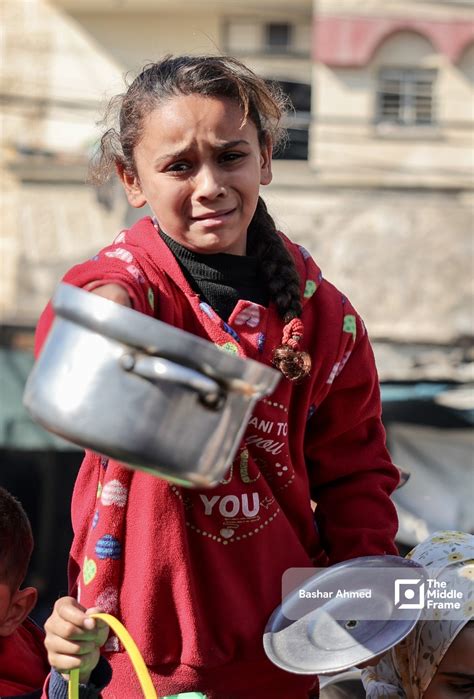 Distraught Palestinian girl reaches out with an empty cooking pot Gaza Strip-Palestine. • The ...