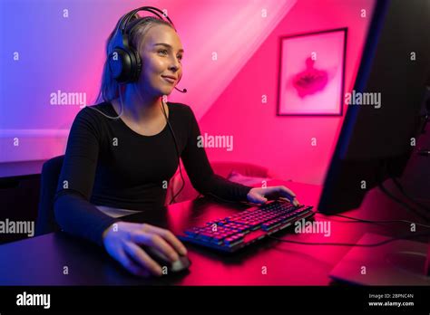 Happy Pretty Blonde Gamer Girl Playing Online Video Game on Her Personal Computer Stock Photo ...