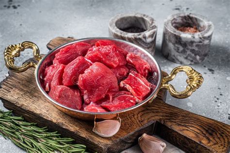 Uncooked Raw Diced Beef Veal Meat for Stew in Skillet. Gray Background Stock Photo - Image of ...