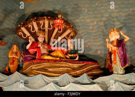 Lord Vishnu resting on Sheshnag(Snake Stock Photo - Alamy