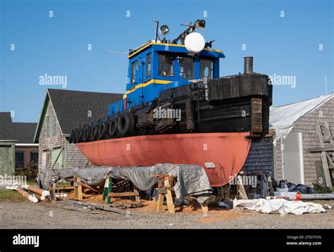 Old Tugboat Under Repair A well-preserved tugboat awaits further restoration at a New England ...