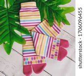 Image of Colorful pair of striped pink socks | Freebie.Photography
