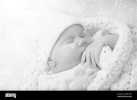 Newborn baby girl sleeping on a soft pillow Stock Photo - Alamy