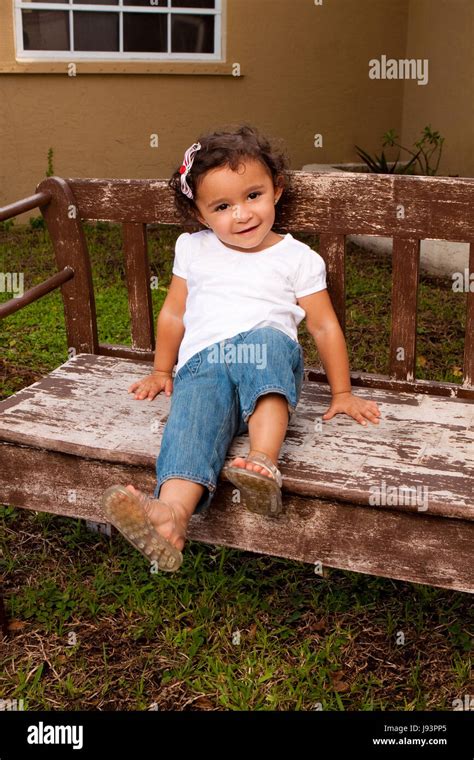 Little girl smiling and laughing outside Stock Photo - Alamy