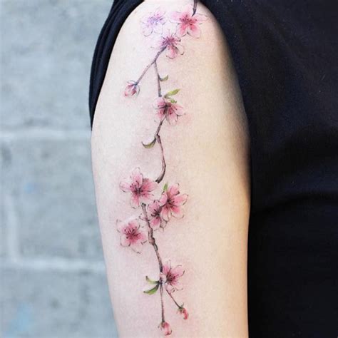 Cherry blossoms tattoo on the right arm by Helen Xu | Blossom tattoo, Cherry blossom tattoo ...