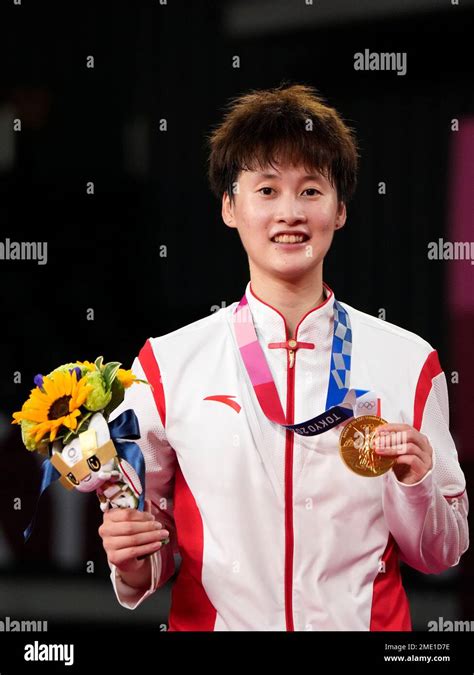 Gold medalist China's Chen Yu Fei shows her medal during the medals ...