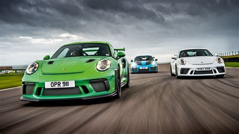 Porsche 911 GT3 vs GT3 RS vs GT2 RS - track battle | evo