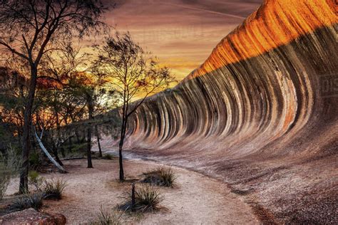 Sunrise at Wave Rock (Hyden Rock), Hyden, Western Australia - Stock Photo - Dissolve