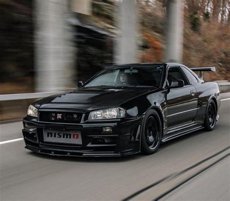 Gorgeous Black Nissan Skyline R34 GT-R running on road : carporn Nissan ...