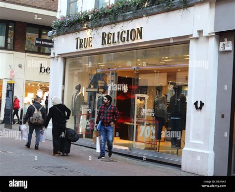 True Religion brand logo seen in Carnaby Street in London, UK Stock ...