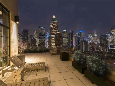 A luxurious NYC duplex penthouse offers dramatic skyline views