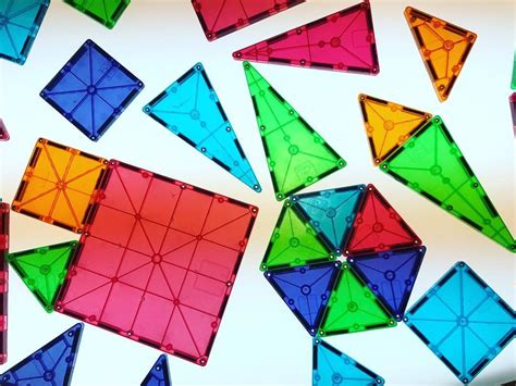 many different colored geometric shapes on a white surface