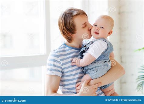 Happy Father Kisses His Baby Stock Photo - Image of girl, care: 97917538