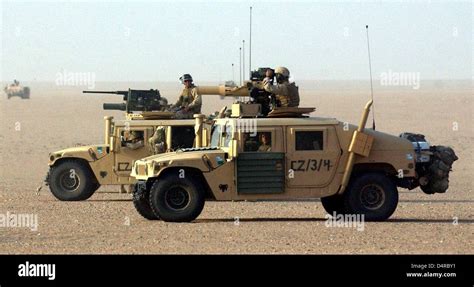 Humvee military vehicles of the US Marine, armed with heavy machine ...