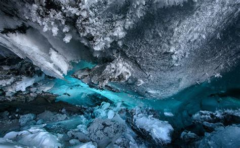 Ice crystals accentuate the walls of an cave under Matanuska Glacier in Alaska. Caves in ...