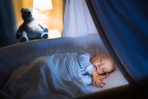 Baby boy sleeping at night stock image. Image of girl - 75757075