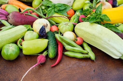 Premium Photo | Fresh harvest from the gardens on wooden chalkboard from above.