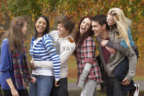 Royalty Free Image | Group Of Six Teenage Friends Having Fun In Autumn ...