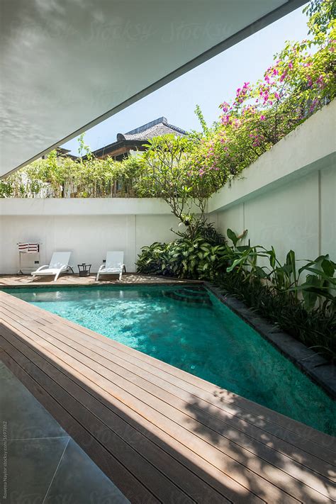 "Small Triangular Pool At Villa" by Stocksy Contributor "Rowena Naylor ...