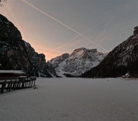 Winter Landscape View with Frozen Pragser Wildsee Lake at Sunrise, Clear and Purple Sky ...