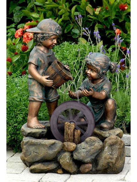 Two adorable children play among a water wheel. | Indoor water ...