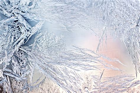 Ice crystals on window - Stock Photo - Dissolve