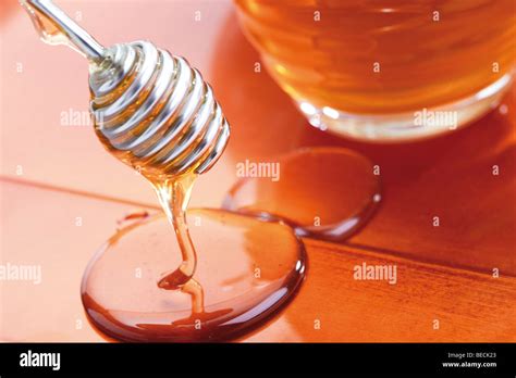 Honey dipper Stock Photo - Alamy