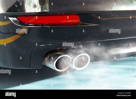 Car exhaust while leaving a smoke Stock Photo - Alamy