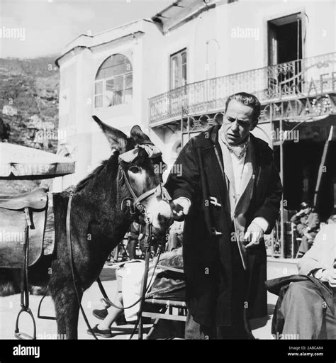 BEAT THE DEVIL, Humphrey Bogart and friend on location in Italy, 1953 ...