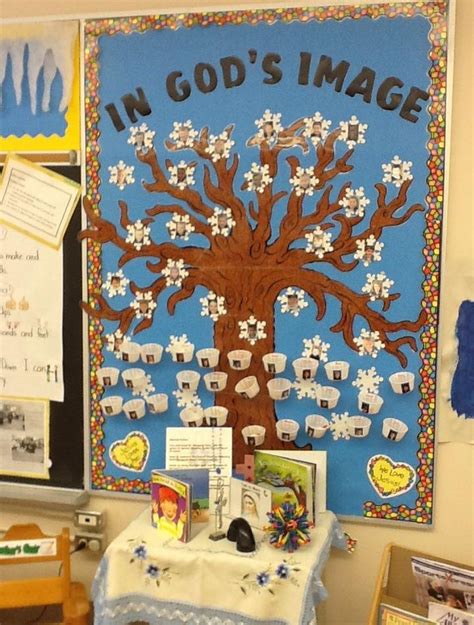 a bulletin board with an image of a tree on it and other items around it