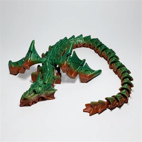 STL file Articulated Steampunk Dragon・3D printer design to download・Cults