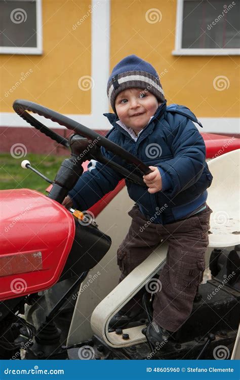 Baby on tractor old stock photo. Image of enjoyment, happy - 48605960