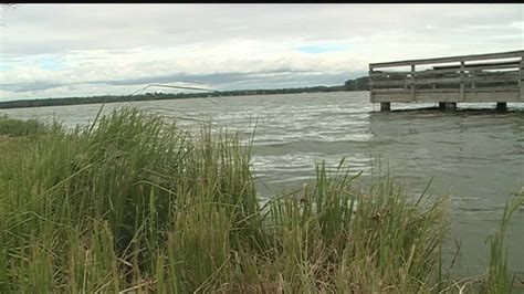 Workers deepening lake to improve water clarity